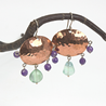 Hammered copper earrings with with fluorite and amethyst stones on sterling silver ear hooks. Designed and handcrafted by Ula Frou creator Sadie Hodson on Salt Spring Island. 