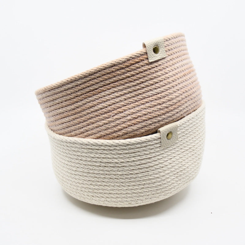 Rope basket sewn from 100% cotton rope, machine sewn and hand dyed in cream and rose shades using plant based dyes handmade by designer Andromeda Nelson on Salt Spring Island. All dye baths are produced in small quantities and every item is a one-of-a-kind piece.