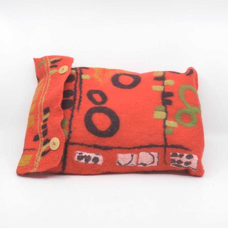 Handmade felt cushion cover in red merino wool, with cushion included. Made by Pender Island fibre artist Debbie Katz. 