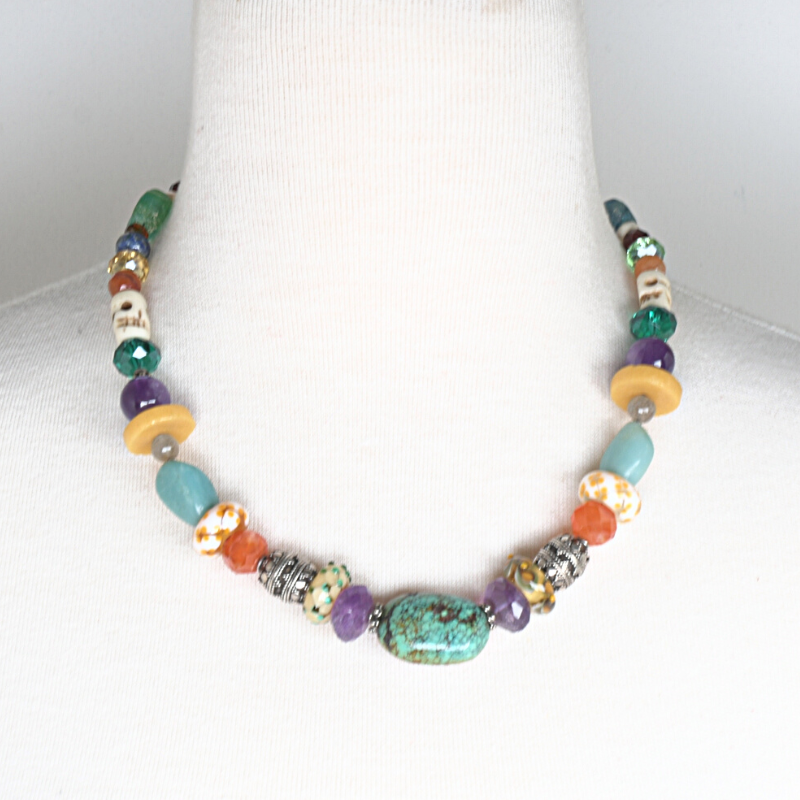 Colourful beaded necklace with turquoise, amethyst, carnelian, Lapis lazuli, and rose quartz stones, and beads made from bone, crystal, sterling silver, flame-worked and recycled glass. Designed and handcrafted by Ula Frou creator Sadie Hodson on Salt Spring Island. 