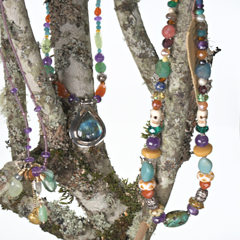 Colourful beaded necklaces made with turquoise, amethyst, carnelian, Lapis lazuli, and rose quartz stones, and beads made from bone, crystal, sterling silver, flame-worked and recycled glass. Designed and handcrafted by Ula Frou creator Sadie Hodson on Salt Spring Island. 